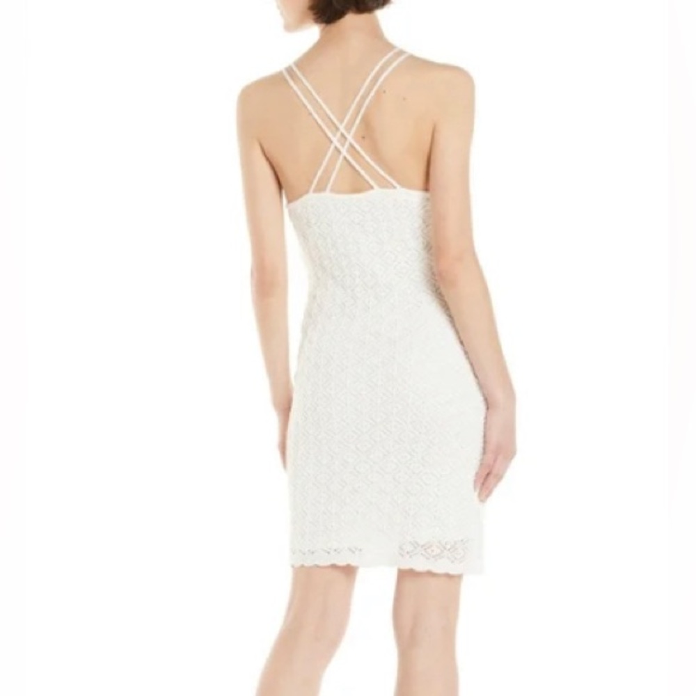 This is a gorgeous dress! It’s an off white beautifully made crochet dress!
